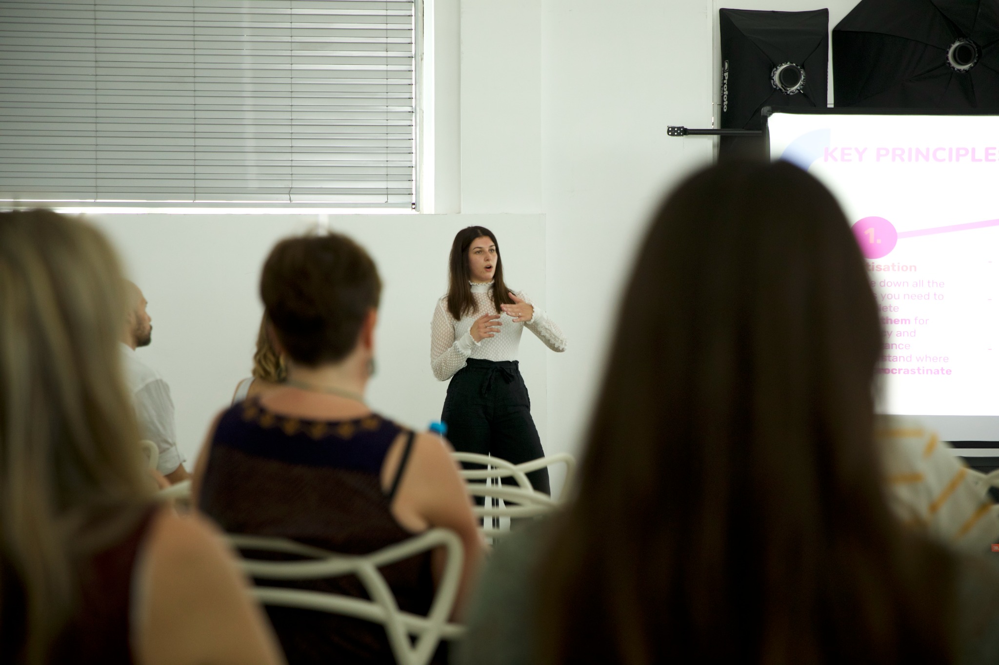 Abigail speaking at a workshop